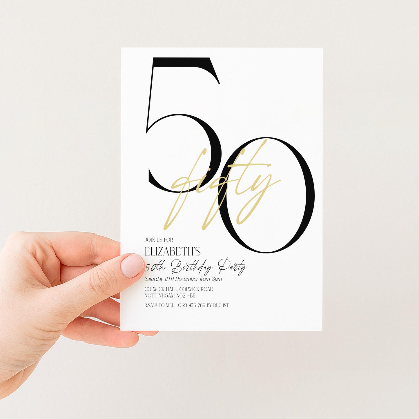 A person's hand holding a white invitation card with a large number "50" and text indicating a 50th birthday party.