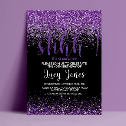 The image is a birthday party invitation for the 40th birthday of Lucy Jones. The invitation has a purple and black color scheme with a glittery purple background and the word "shh" written in purple. The invitation invites guests to join the celebration of the 40th birthday of Lucy Jones and provides details about the event, including the date, time, location, and contact information.