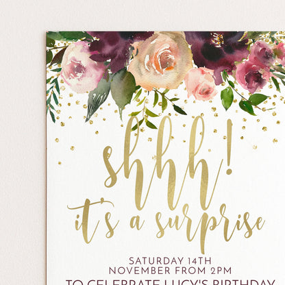 A birthday party invitation with a floral design and the text "shhh! it's a surprise" in gold lettering.