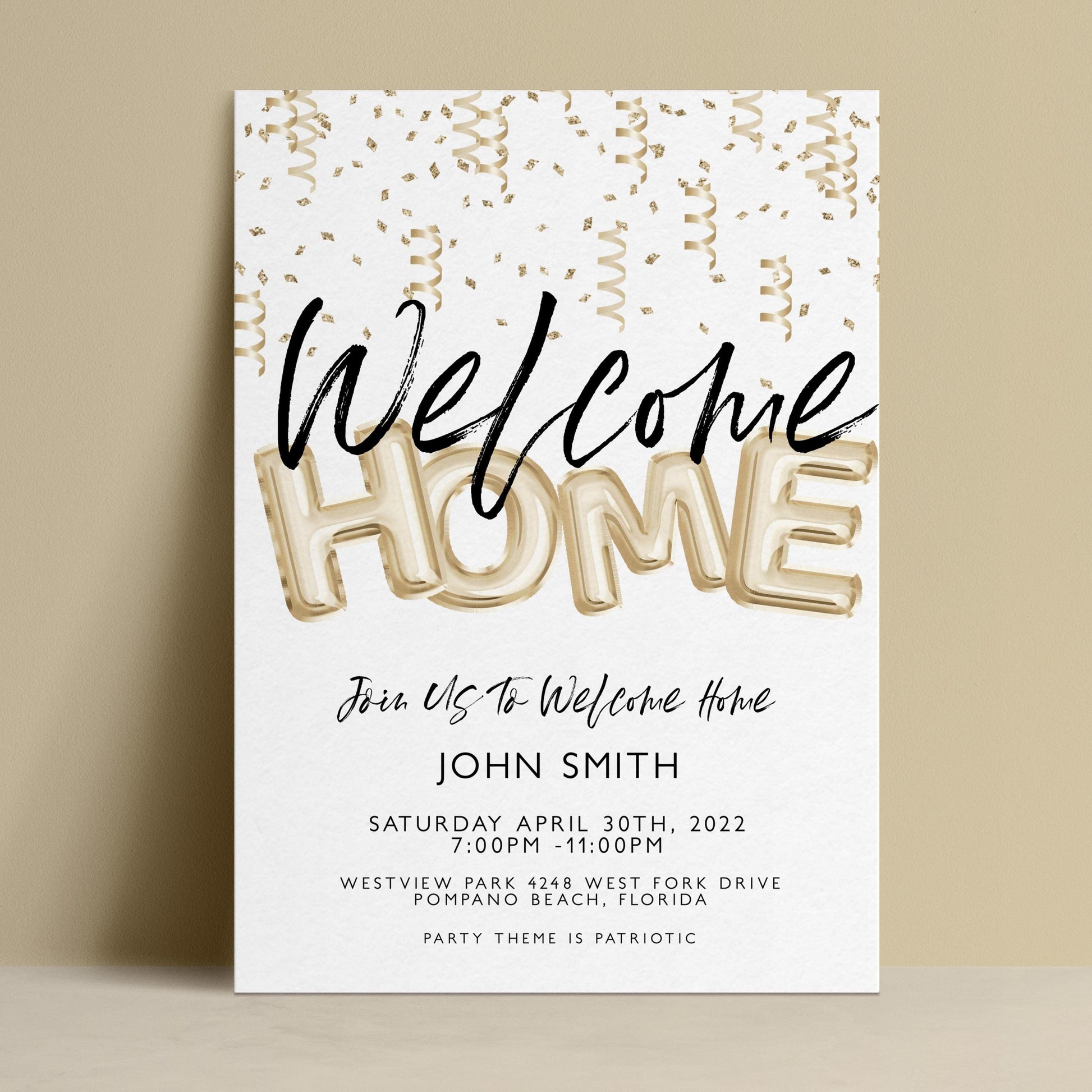 The image is a welcome home invitation card featuring gold foil lettering and confetti-like elements.