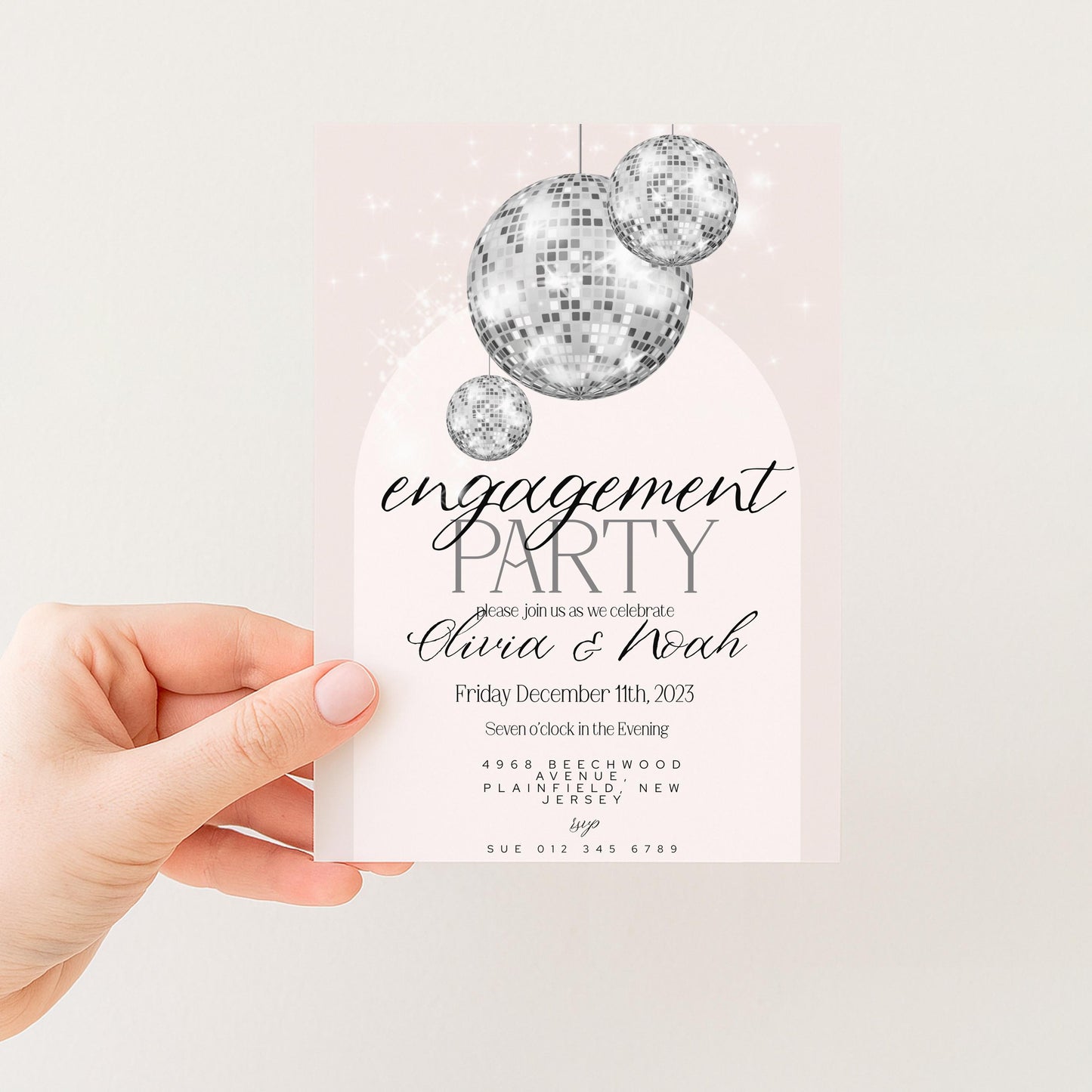 The image is a hand holding a party invitation card with a disco ball design.