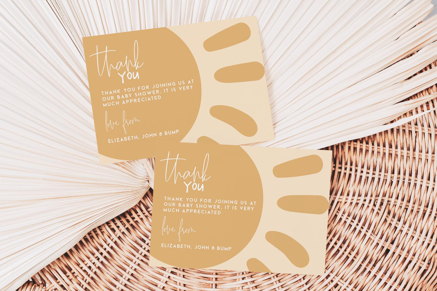 two beige cards with text on them, placed on a woven surface.