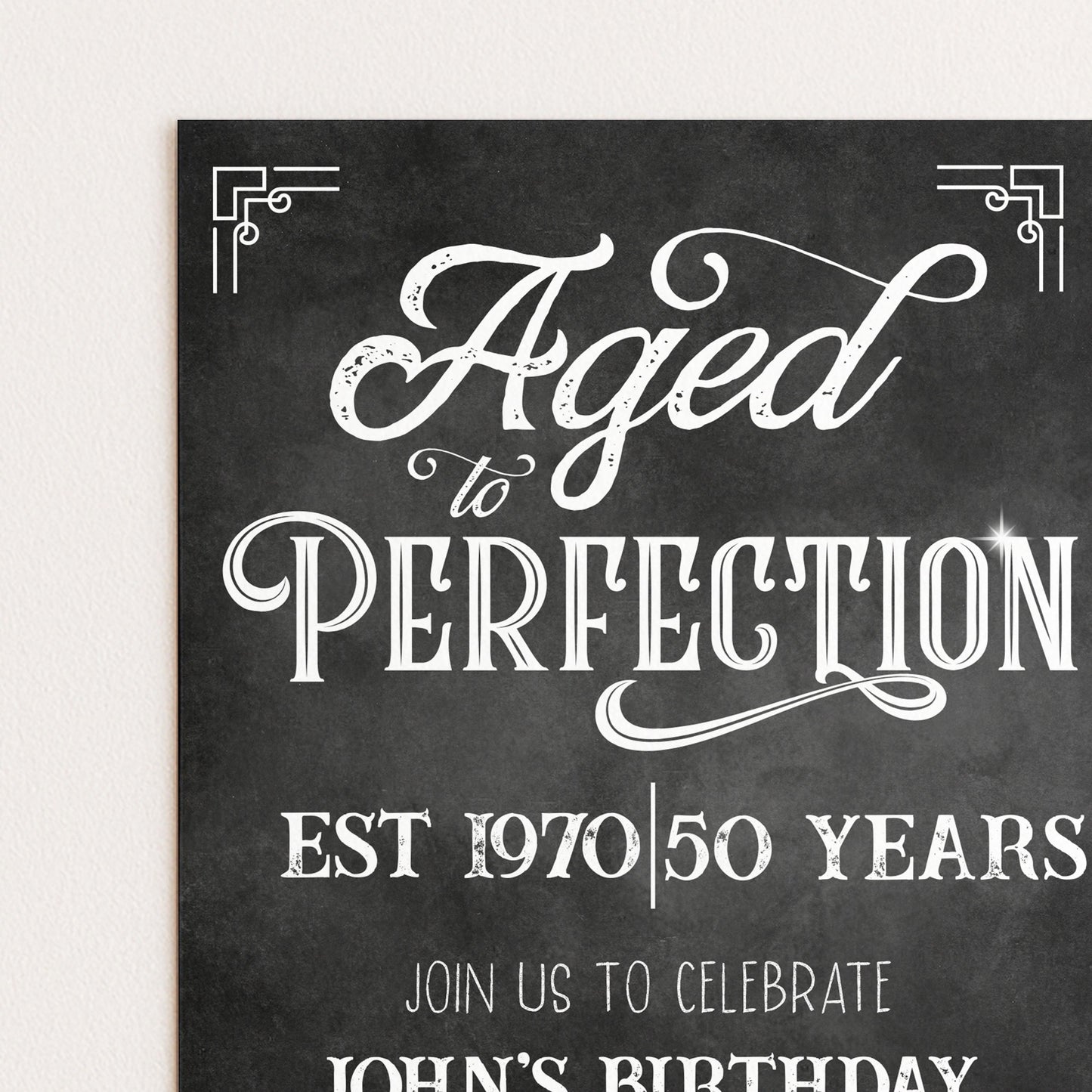 The image is a black and white invitation card with a vintage-style design. The text on the card reads "Aged to Perfection" and "Est 1970/50 Years" along with "Join Us to Celebrate John's Birthday".