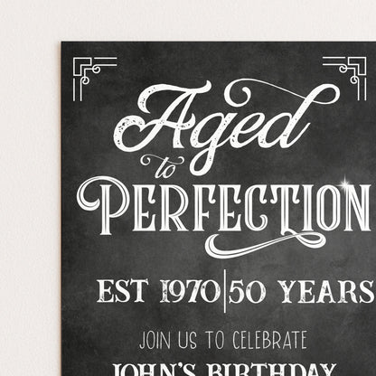 The image is a black and white invitation card with a vintage-style design. The text on the card reads "Aged to Perfection" and "Est 1970/50 Years" along with "Join Us to Celebrate John's Birthday".