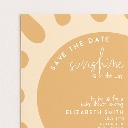 The image is a baby shower invitation with a sun-shaped design and text.