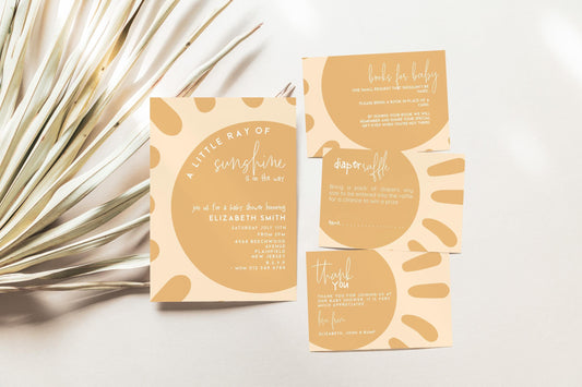 a set of baby-related items, including a baby shower invitation, a baby book, and a baby-themed thank you card, all set against a white background with some palm fronds.