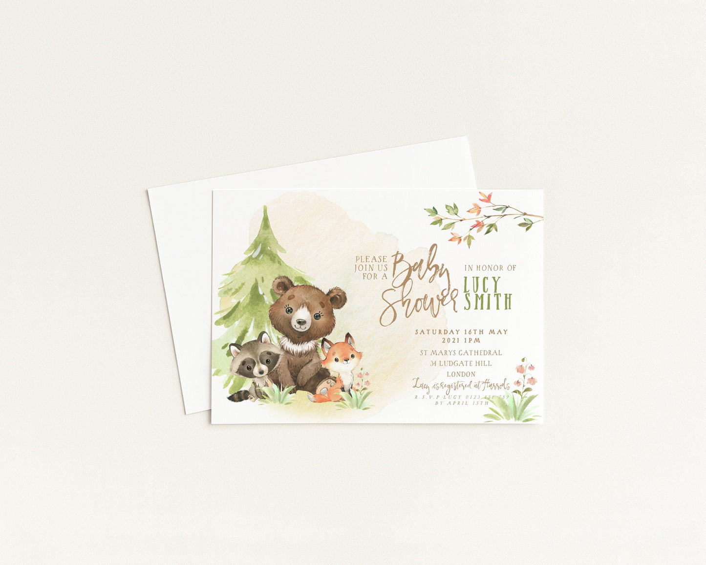 A baby shower invitation featuring a forest scene with a bear, raccoon, and fox, along with the names of the expectant mother and father.
