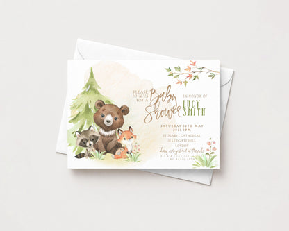 A baby shower invitation featuring a bear, raccoon, and fox, along with the names of the expectant mother and father.