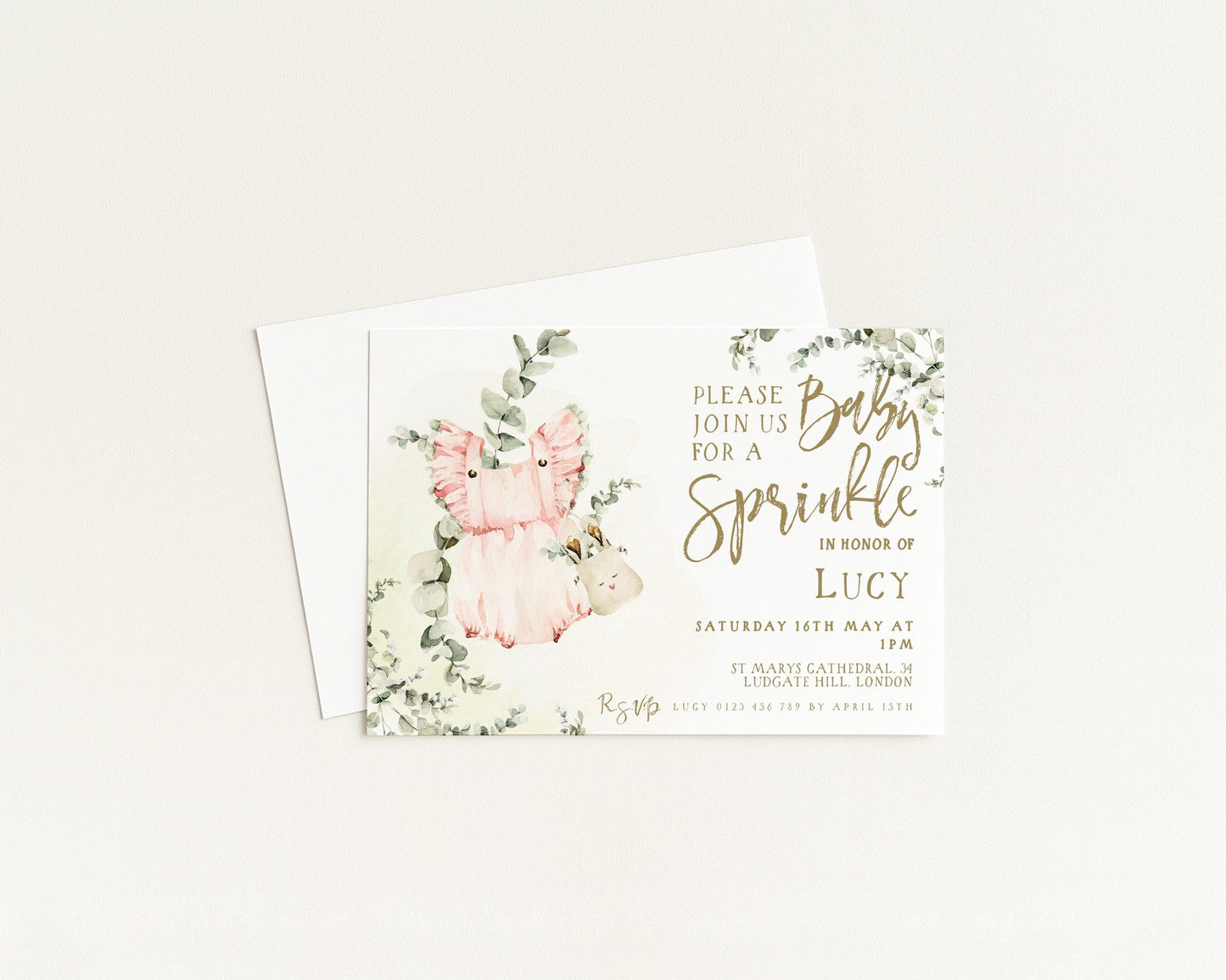 The image is a baby shower invitation featuring a pink and green floral design with a baby's image and text inviting guests to a sprinkler party in honor of Lucy.