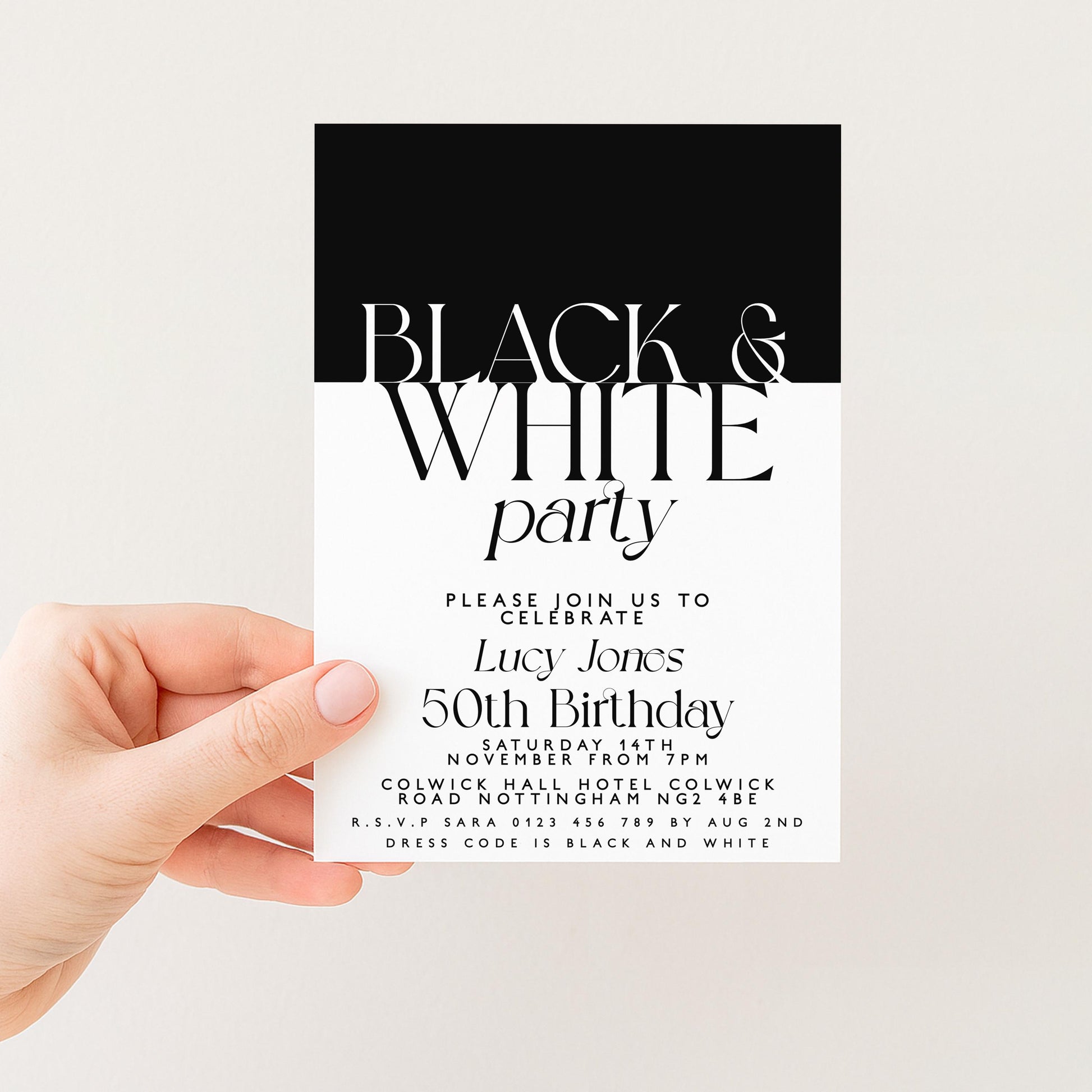 a person holding a black and white invitation card for a birthday party.