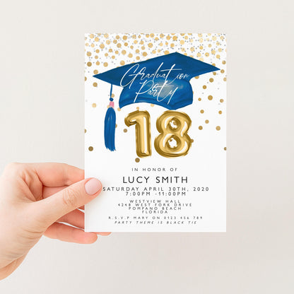 a person holding a graduation party invitation card.