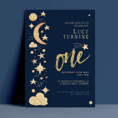 The image is a birthday party invitation for a child named Lucy, who is turning one. The invitation features a dark blue background with gold stars and a crescent moon, along with the text "Please join us to celebrate Lucy Turning one" and the date and time of the party.