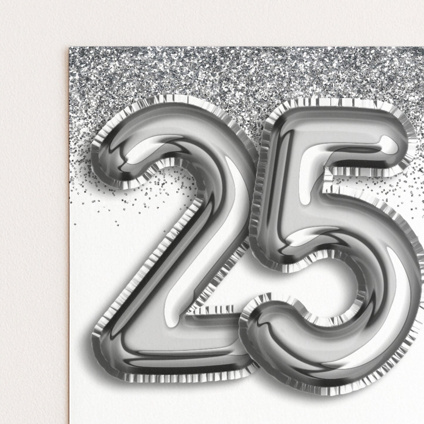 a large number 25 made of shiny silver foil or metallic material, with a glittery background.