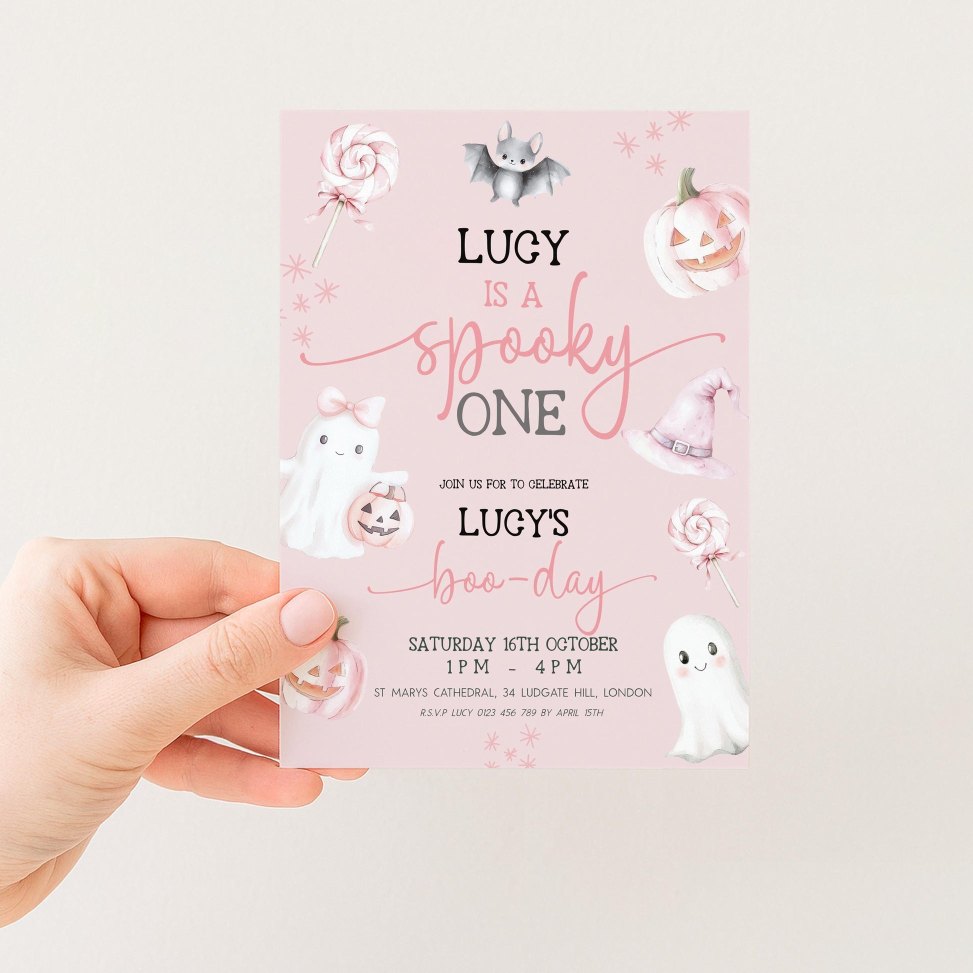 The image is a pink invitation card for a "Spooky One" party, featuring illustrations of a bat, pumpkin, ghost, and ghost.