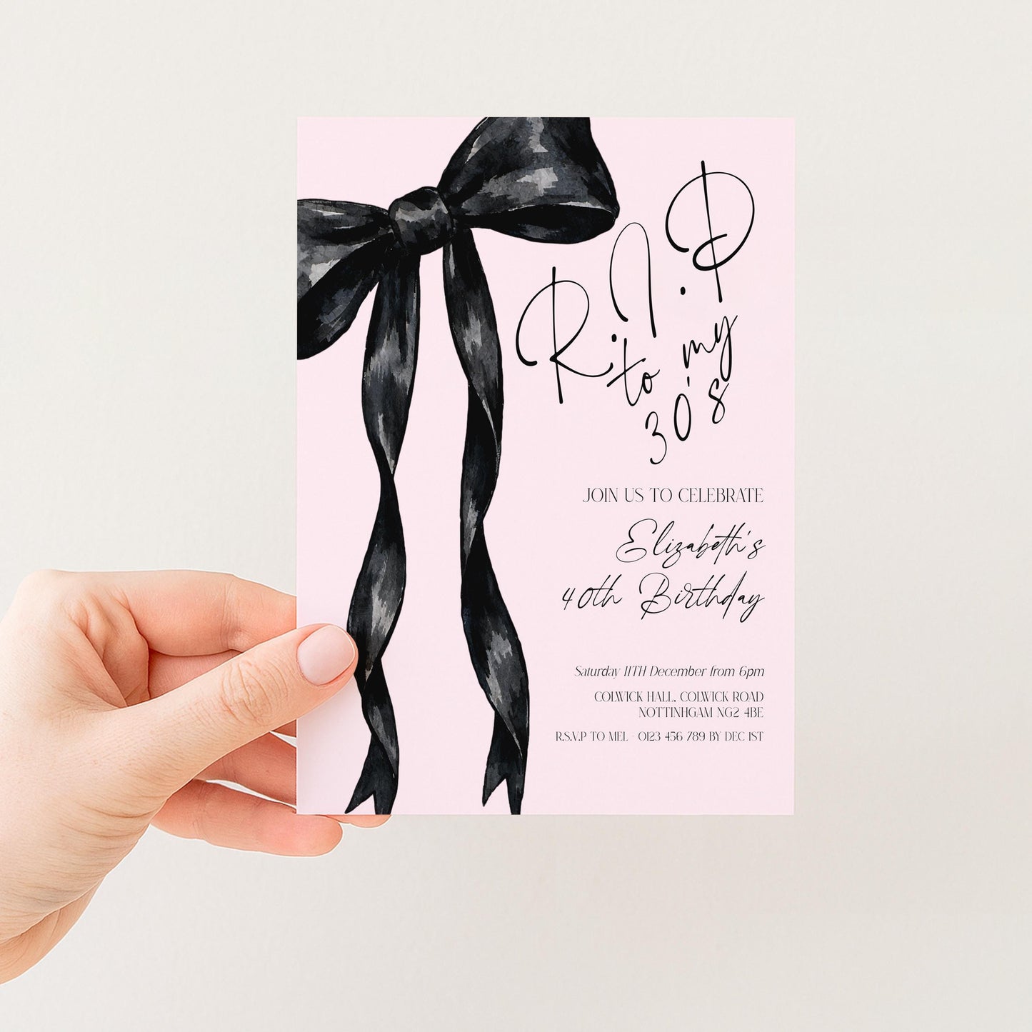 The image is a birthday invitation card with a pink background and a black ribbon design.