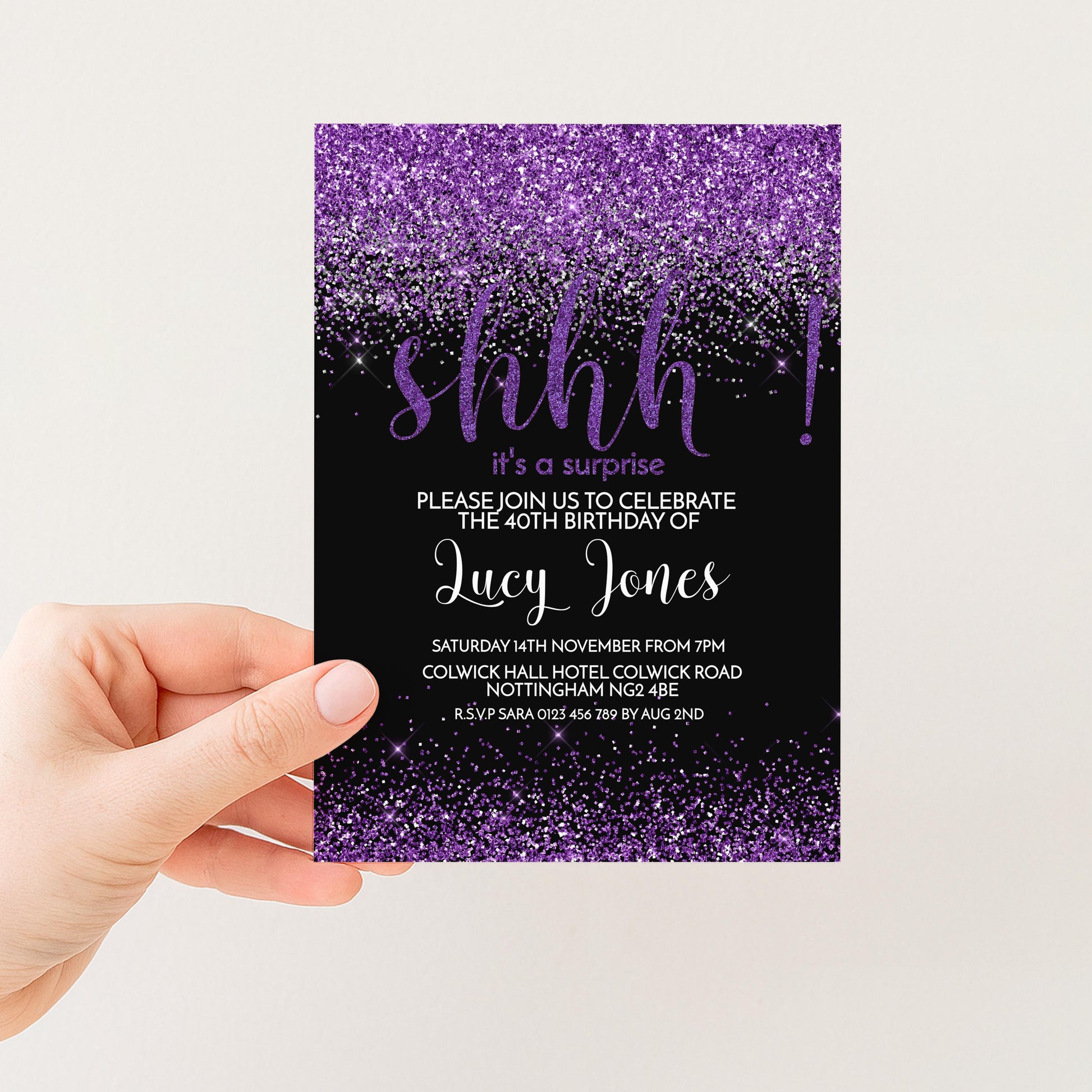 The image is a hand holding a purple and black invitation card with a glittery purple background and the word "shh" written on it.