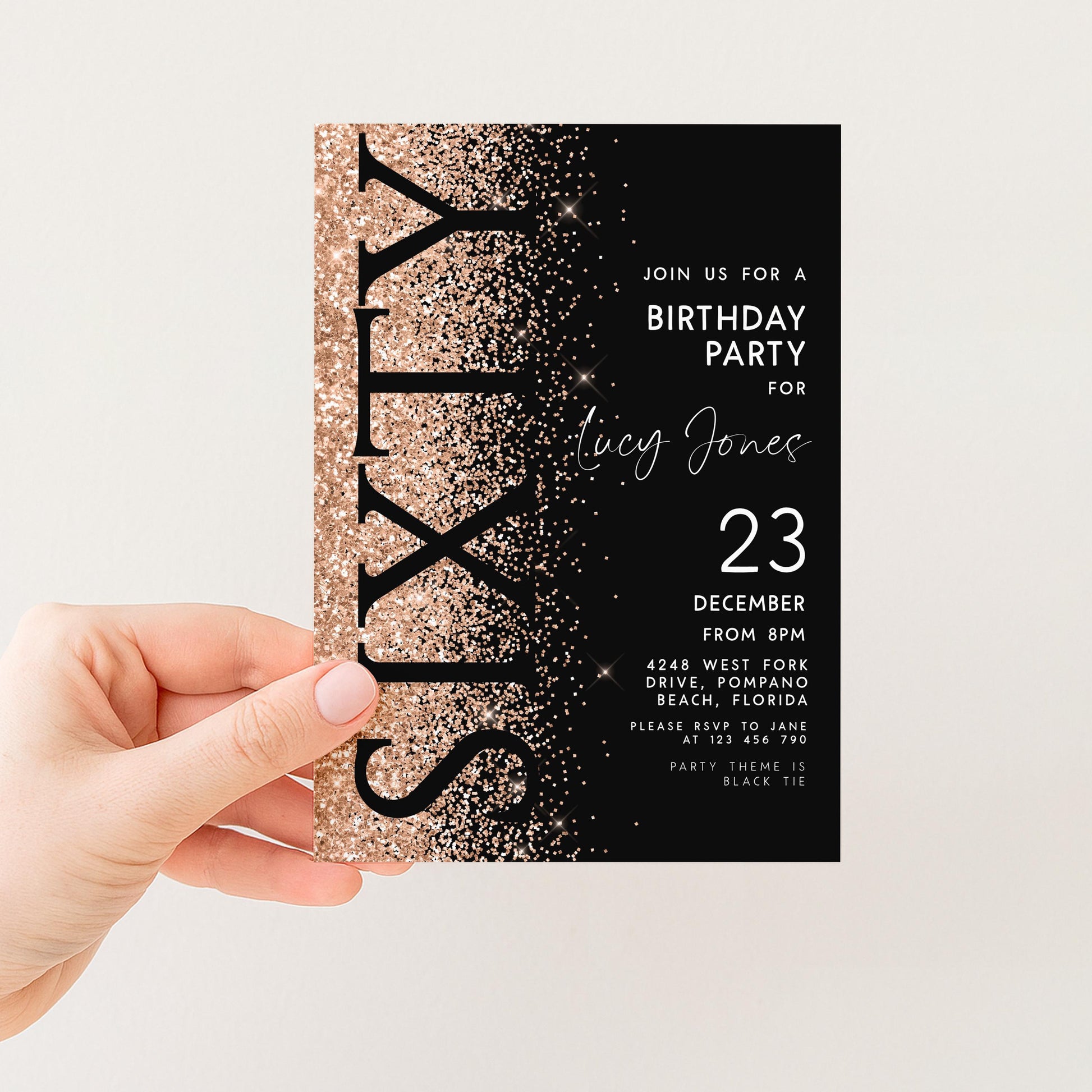 a hand holding a birthday party invitation card with a black background and gold glitter accents. The text on the card invites guests to a birthday party for someone named Lucy Jones, with the date and location specified as December 23 from 8 PM at the Beach, Florida.