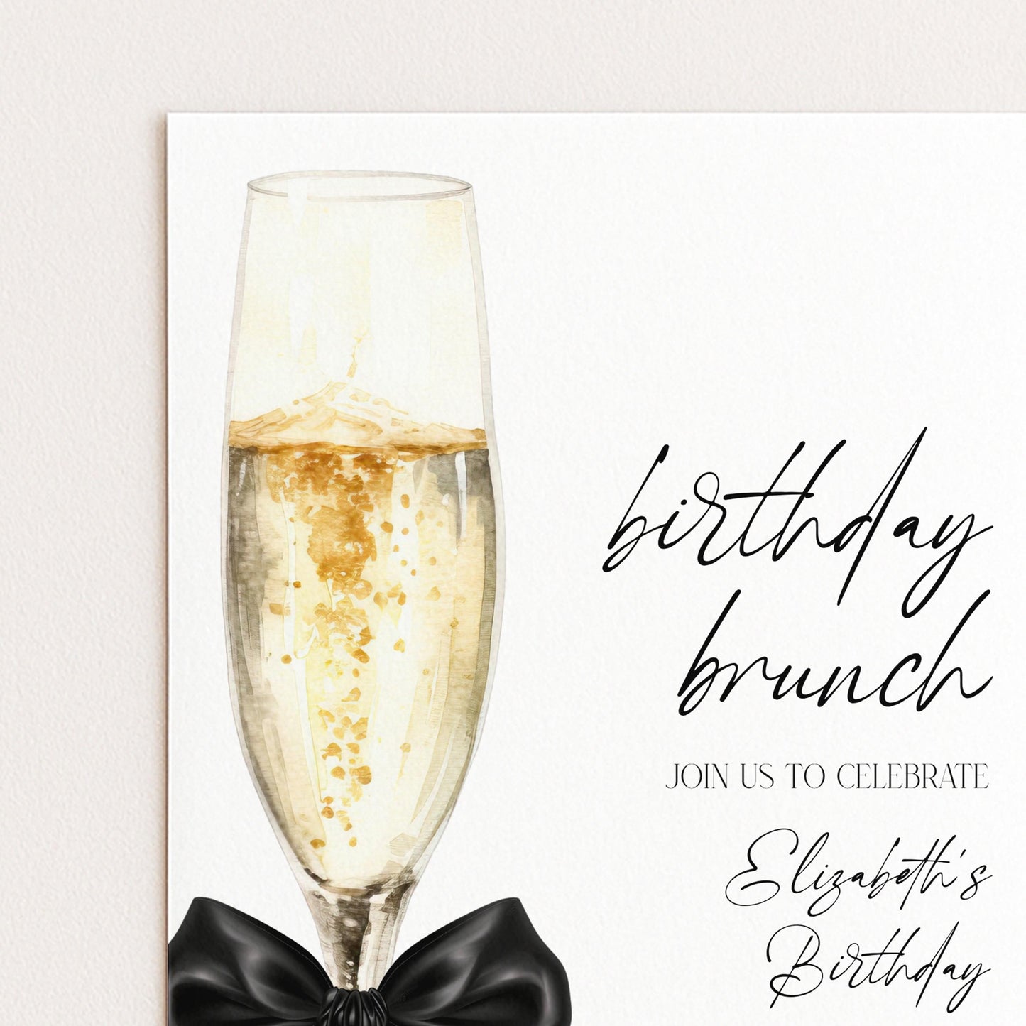 The image is a birthday brunch invitation featuring a glass of champagne with a black bow, accompanied by the text "Join us to celebrate Elizabeth's Birthday".