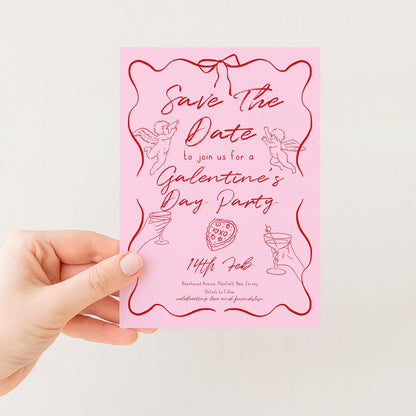 A pink card with a pink background and red text, holding a hand.