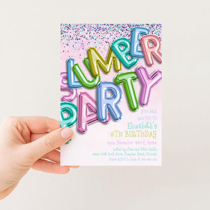 A hand holding a colorful birthday party invitation card with the text "LUMBER PARTY" and "You are invited to Elizabeth's 7th birthday" printed on it.