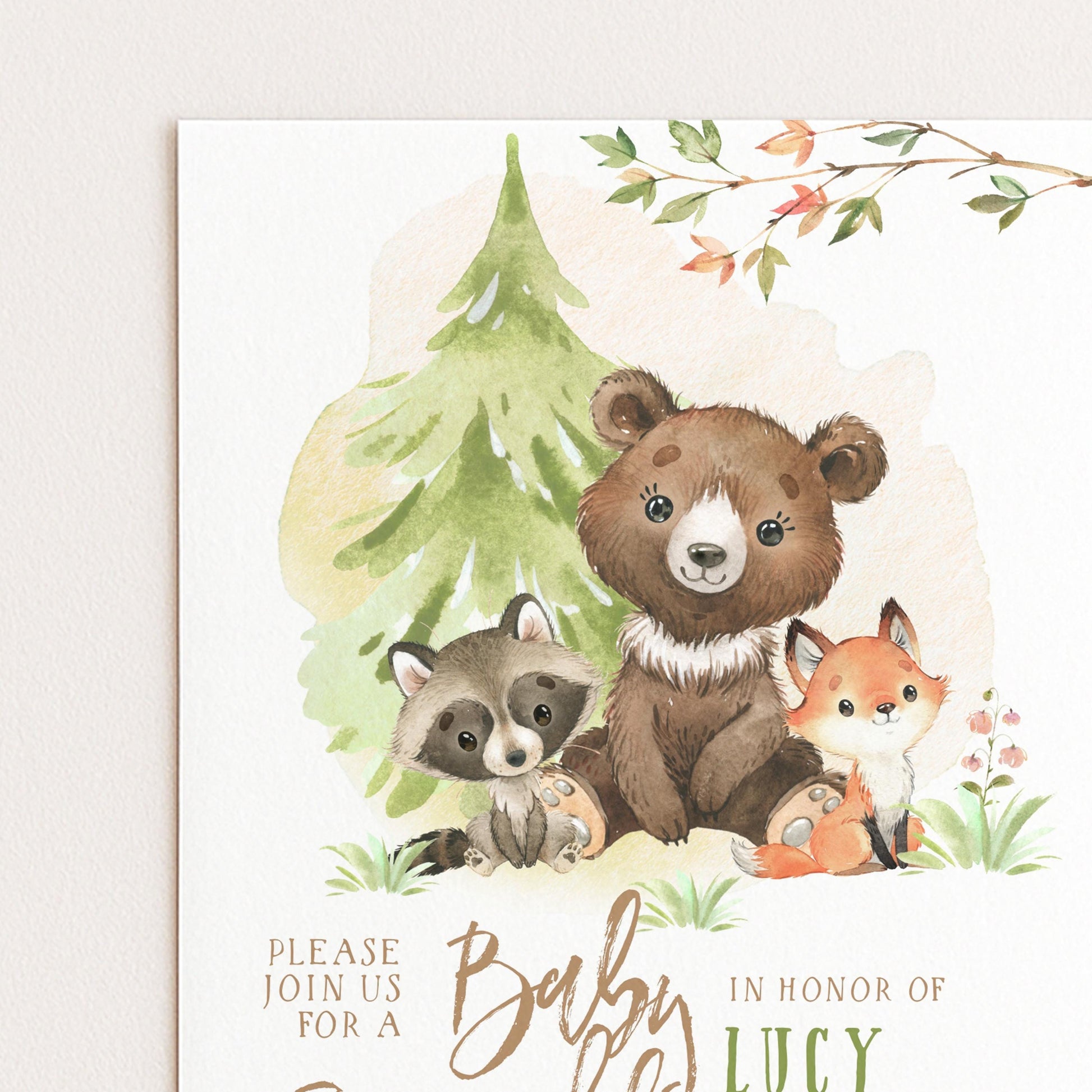 The image is a watercolor painting of a bear, raccoon, and fox sitting together in a forest setting, with a tree in the background.