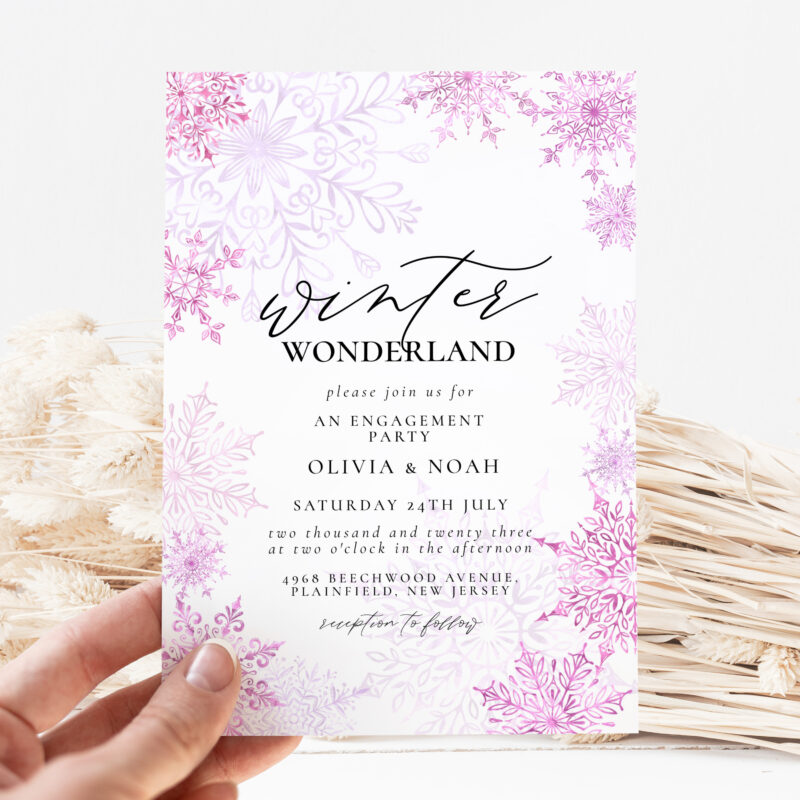 Editable winter engagement party invitation with pink snowflakes and elegant fonts