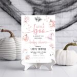 Pink Halloween baby shower invitation with cute ghost, pastel pumpkins, and editable text for a baby girl shower