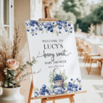 Editable blueberry baby shower welcome sign with watercolor berries and basket on easel at outdoor event