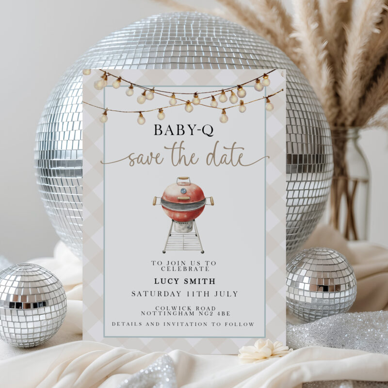 Baby-Q Save the Date invitation in front of disco balls and pampas grass