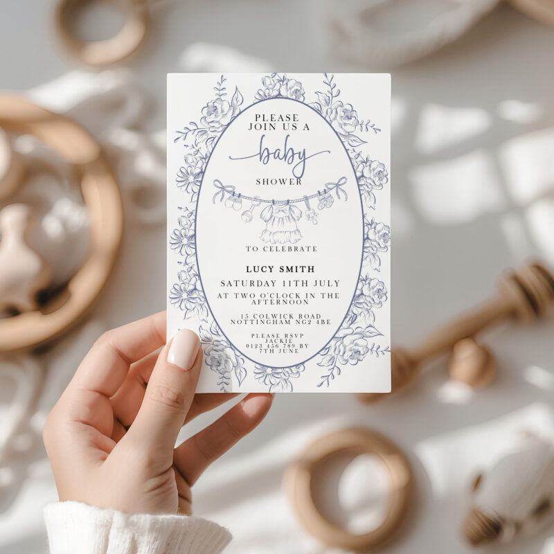 Blue Toile Baby Shower Invitation Template held in hand